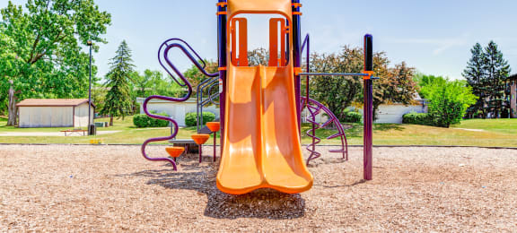 a slide on a playground at a park at Willow Hill Apartments, Justice, IL