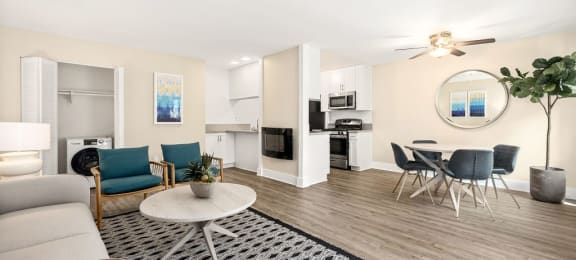 Apartments for Rent in Marina Del Rey, CA - Casa De Marina - Living Room with Grey Couch, Circle Coffee Table, Matching Chairs, and Wood-Style Floors