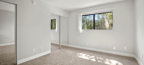 Brody Terrace Bedroom with Mirrored Closet Doors and Carpet