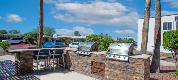 our apartments have an outdoor kitchen with a grill and bbq