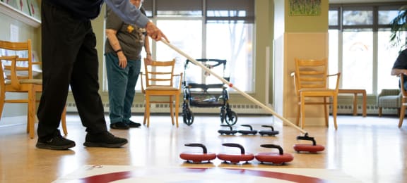 Residents playing a game of curling and living an active life