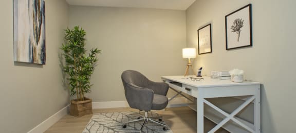a home office with a desk and chair