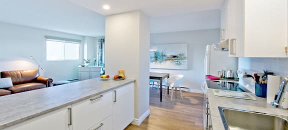 Les Jardins Hauterive in Sherbrooke, QC kitchen with breakfast bar and modern cabinetry