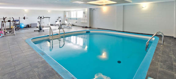 Les Jardins Hauterive in Sherbrooke, QC indoor pool and gym with equipment