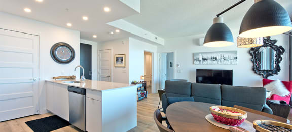 Lumineau in Sherbrooke, QC hard surfacing flooring throughout kitchen, dining and living room
