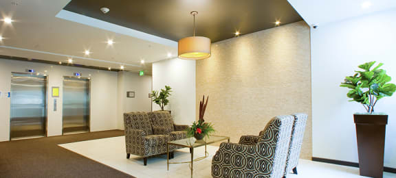 Lobby with seating area located in Building A at Trio on Belmont in Kitchener, ON