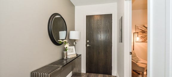 Entry area, with den to the right, in a 2 bed + den 2 bath variation E in building A at Trio on Belmont in Kitchener, ON