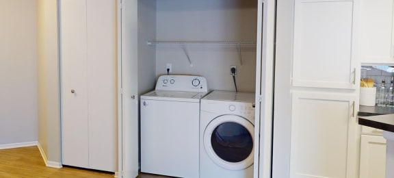 a white washer and dryer in a laundry room