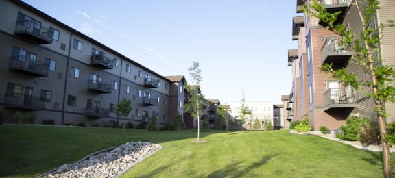 Exterior River Ridge Balconies and Green Lawn