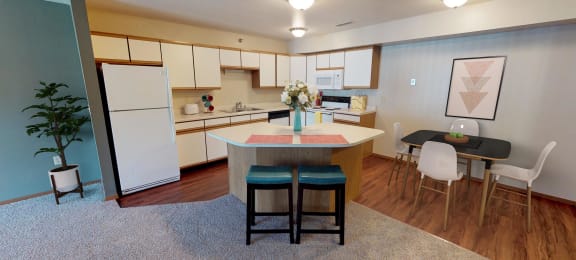 Full Kitchen with Island and White Cabinets, Small Dining Table