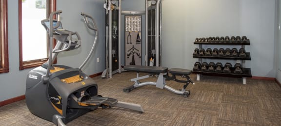 Weights and cardio equipment all available for use in the fitness center.