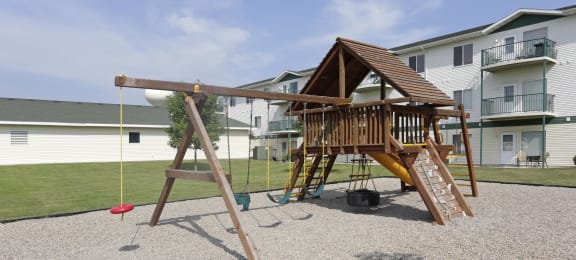 A community playground complete with swings for having fun outside.