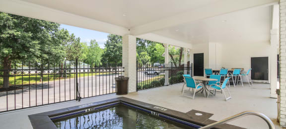 pool and patio at the whispering winds apartments in pearland, tx