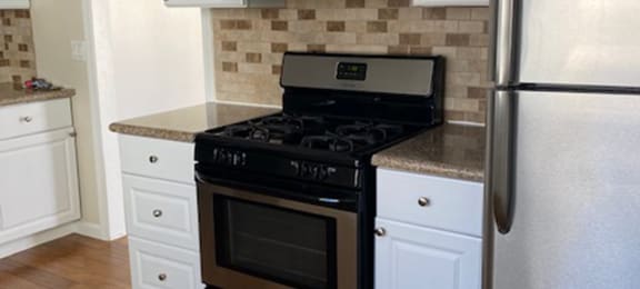 kitchen with appliances and tile backsplash