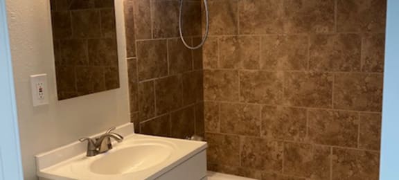 bathroom with tile shower