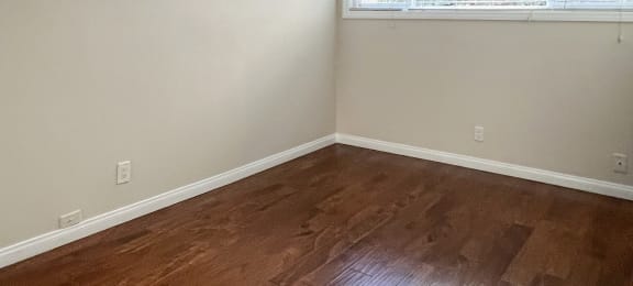 bedroom with wood floors and ceiling fan