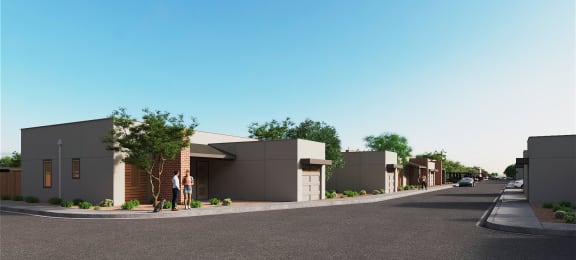 a rendering of a housing development on the corner of a street with people standing in front of at Marketside Villas at Verrado, Buckeye