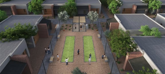 an aerial view of a courtyard with people playing tennis at Marketside Villas at Verrado, Buckeye Arizona