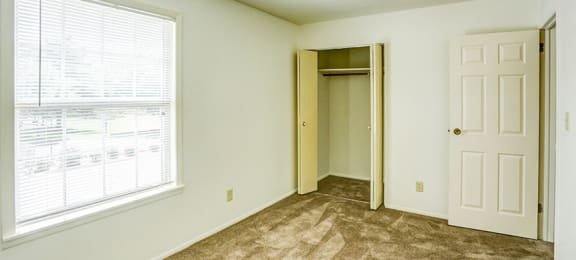 Townhome Guest Bedroom with a Window and a Closet at Williamsburg on the Lake Valparaiso