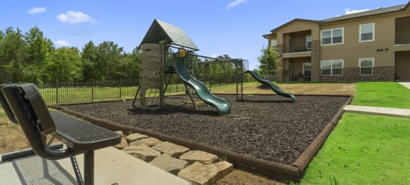 the preserve at ballantyne commons playground with slides and a swing set
