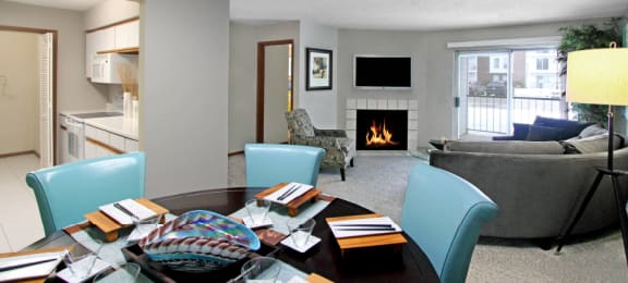 Spacious floor plan, open floor plan, spacious apartment with woodburning fireplace, spacious kitchen, spacious dining room, and bright white kitchen at The Vanderbilt Apartments in Omaha, Nebraska