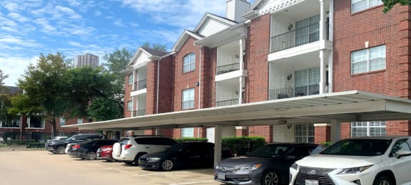 Luxury apartments with brick exteriors, covered parking, private storage, extra storage, at Tuscany Apartments in Houston.