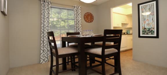 Spacious dining room and bright white kitchens at Plantation apartments in Houston.