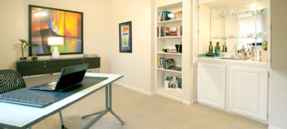 Spacious den or office with wet bar and built-in shelves at The Biltmore Apartments in Omaha, Nebraska