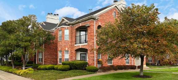 Luxury apartments located at 70th and Pioneers Blvd with red brick exterior and scenic views