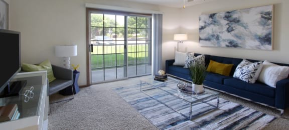 Apartments in central Lincoln Nebraska with spacious living room, spacious floor plan, spacious balcony at Tanglewood Apartments