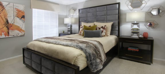 Spacious bedroom that can fit a king size bed with walk-in closet and attached bathroom at Preston Village Apartments in north Dallas