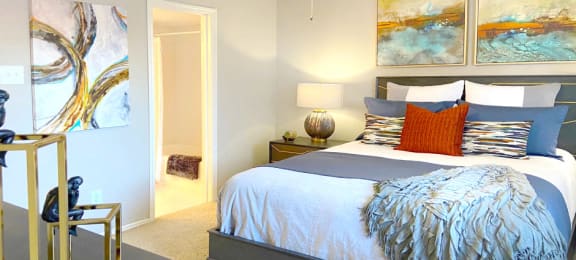 Spacious bedroom that can fit a king size bed with walk-in closet and attached bathroom at Preston Village Apartments in north Dallas