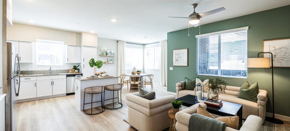an open living room with a kitchen and a dining room at SYNC APARTMENT HOMES, North Las Vegas