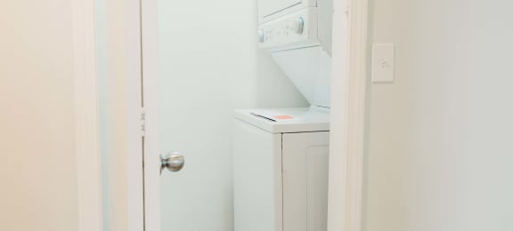 a small laundry room with a washer and dryer in it