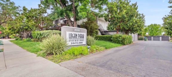 Apartments for Rent in Fremont, CA - Logan Park - Exterior View of Logan Park Apartment Building with Lush Landscaping.