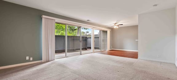 Apartments for Rent Fremont CA - Logan Park - Huge Empty Living Room with Carpet and Sliding Glass Door to Patio