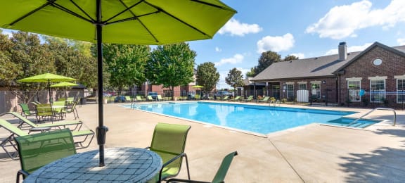 our apartments offer a swimming pool with chairs and umbrella