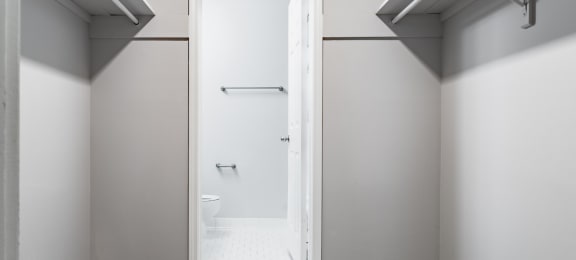 a bathroom with gray walls and a white toilet