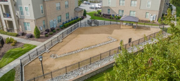 an aerial view of an empty playground in an apartment complex