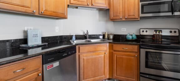 Upgraded Kitchen with wooden cabinets and appliances at Versailles on the Lakes Oakbrook*, Oakbrook Terrace, IL