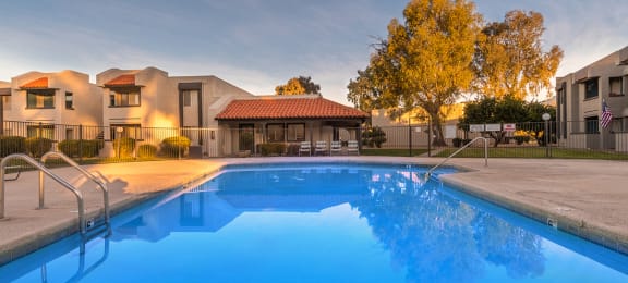 Riverstone pool view with nice view, and lounging area nearby