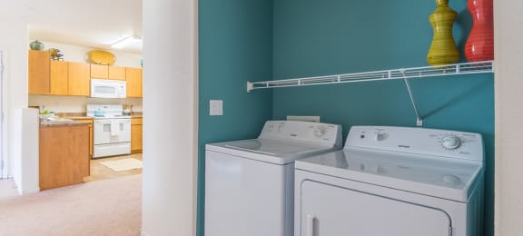 Desert Sands laundry room with a standard washer and dryer.