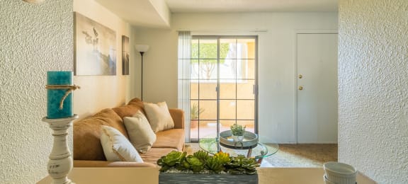 El Encanto spacious living room with sliding glass doors and plenty of natural light and private balconies