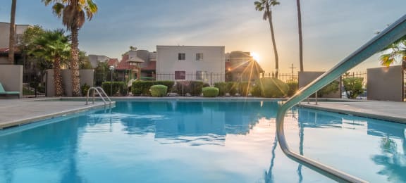 Camino Seco Village view of sparkling pool with handrail on the right side