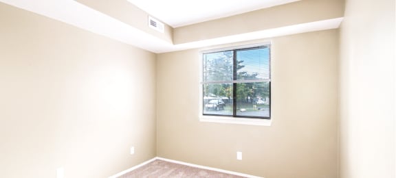 an empty room with a large window