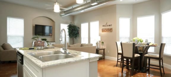 a kitchen and living room with a table and chairs at Kings Cove, Kingwood, TX 77345