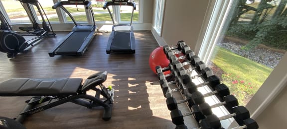 Highland Hills fitness center with free weights  at Highland Hills Apatrtments, Grovetown, Georgia