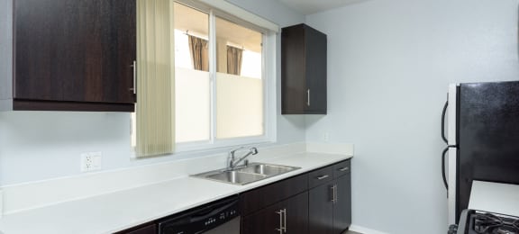Kitchen with whithe countertop and brown