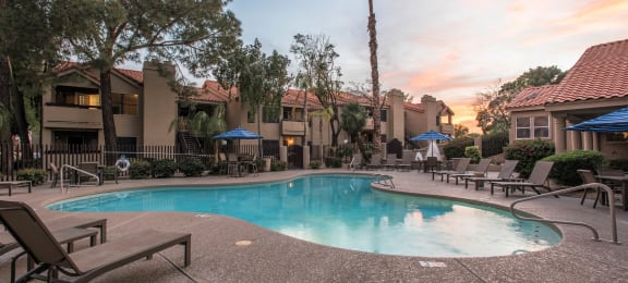 Apartments in Ahwatukee, Phoenix, AZ - Pacific Bay Club - Resort-Style Swimming Pool Surrounded By Lounge Chairs and Umbrellas