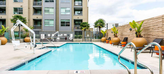 Apartments in Redwood City CA - Franklin 299 - Sparkling Pool with Lounge Seating and Large Plants